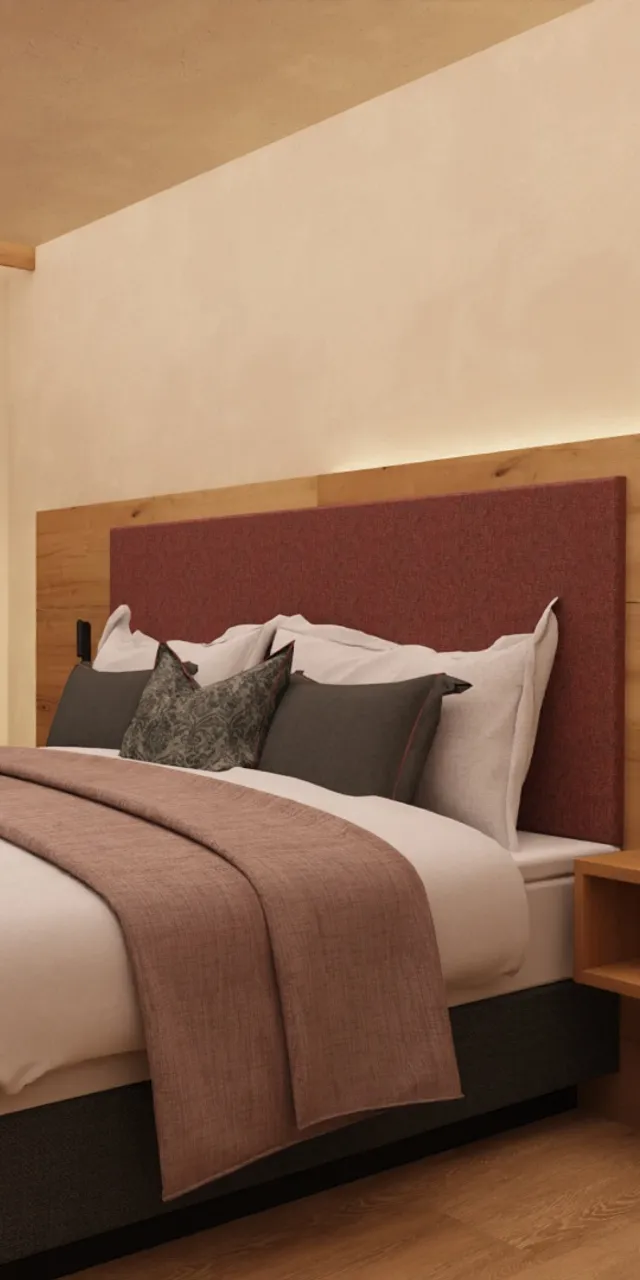 Cozy hotel room with double bed, wooden furniture, and mountain view